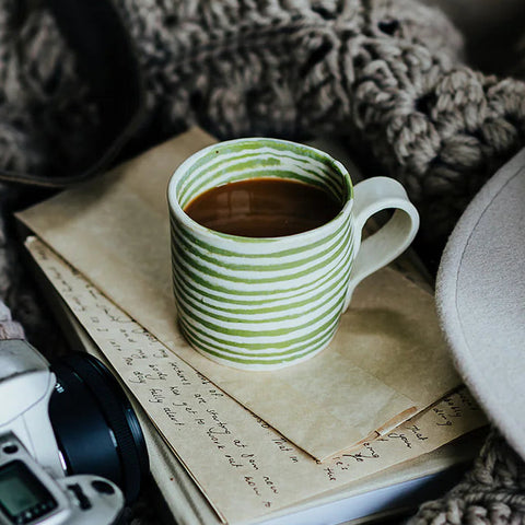 light green striped mug